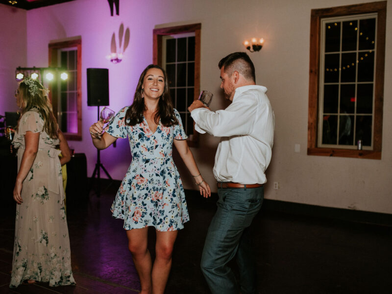 Uplighting by the DJ booth at White Oaks Barn in Dahlonega, GA