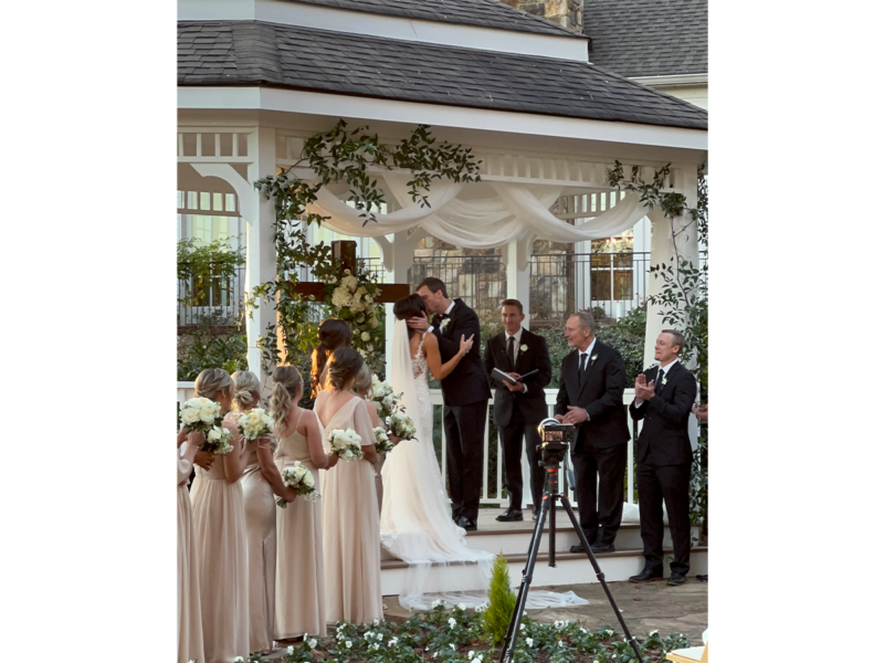 First kiss at wedding ceremony at Little River Farms venue in Alpharetta GA